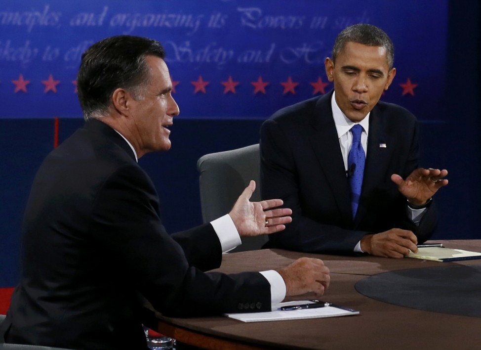 U.S. President Obama and Republican presidential nominee Romney talk during the final presidential debate in Boca Raton