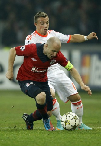 Lille's Balmont challenges Bayern Munich's Shaqiri during their Champion's League Group F soccer match at the Lille Grand Stade stadium in Villeneuve d'Ascq
