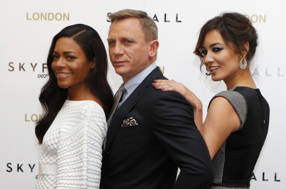 Actor Daniel Craig poses with actresses Naomie Harris and Berenice Marlohe during a photocall to promote the new James Bond film 'Skyfall', at a hotel in central London