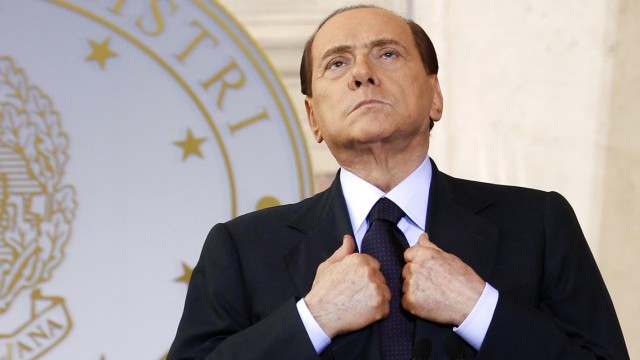 File photo of then Italian Prime Minister Berlusconi leading a news conference at Villa Madama in Rome