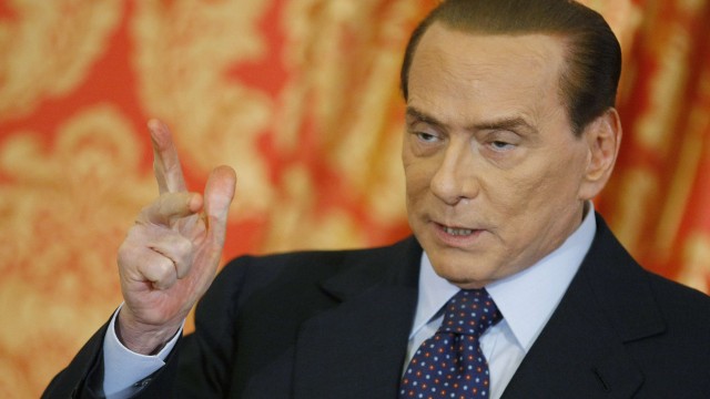 Italy's former Prime Minister Silvio Berlusconi gestures as he speaks during a news conference at Villa Gernetto in Gerno