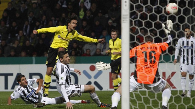 Borussia Dortmund's Hummels scores past VfR Aalen's Kister and VfR Aalen's goalkeeper Fejzic during their German DFB Cup second round soccer match in Aalen