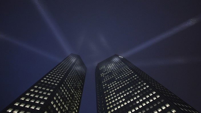 File photo of the headquarters Deutsche Bank being spotlighted during a ceremony in Frankfurt