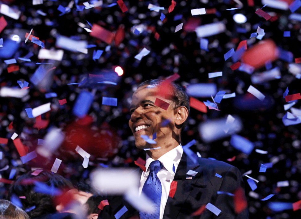U.S. President Obama celebrates on stage as confetti falls after his victory speech during his election rally in Chicago
