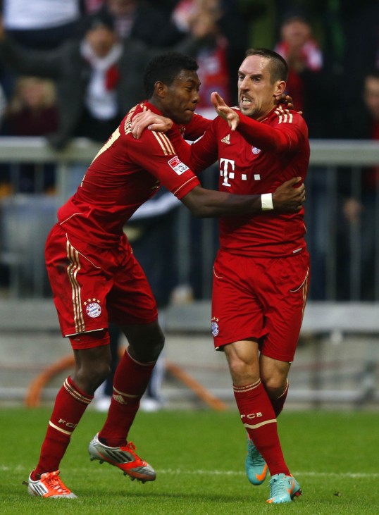 Ribery of Bayern Munich celebrates with team mate Alaba after scoring  against Eintracht Frankfurt during Bundesliga soccer match in Munich