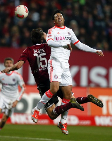Munich's Pizarro challenges FC Nuremberg's Klose during their German Bundesliga first division soccer match in Nuremberg