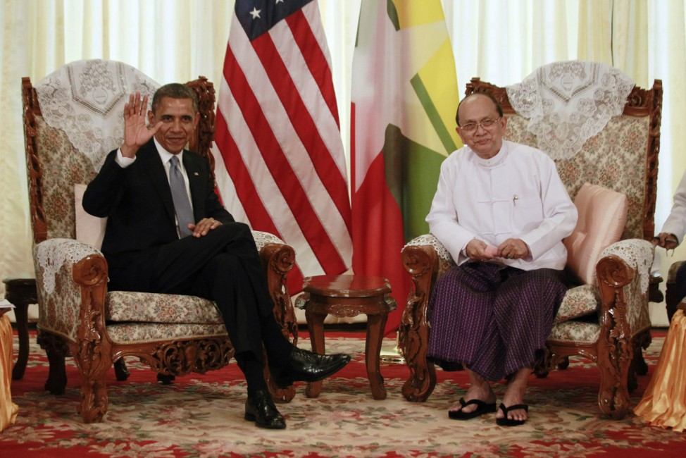 U.S. President Obama waves to the press during his meeting with Myanmar's President Thein Sein in Yangon