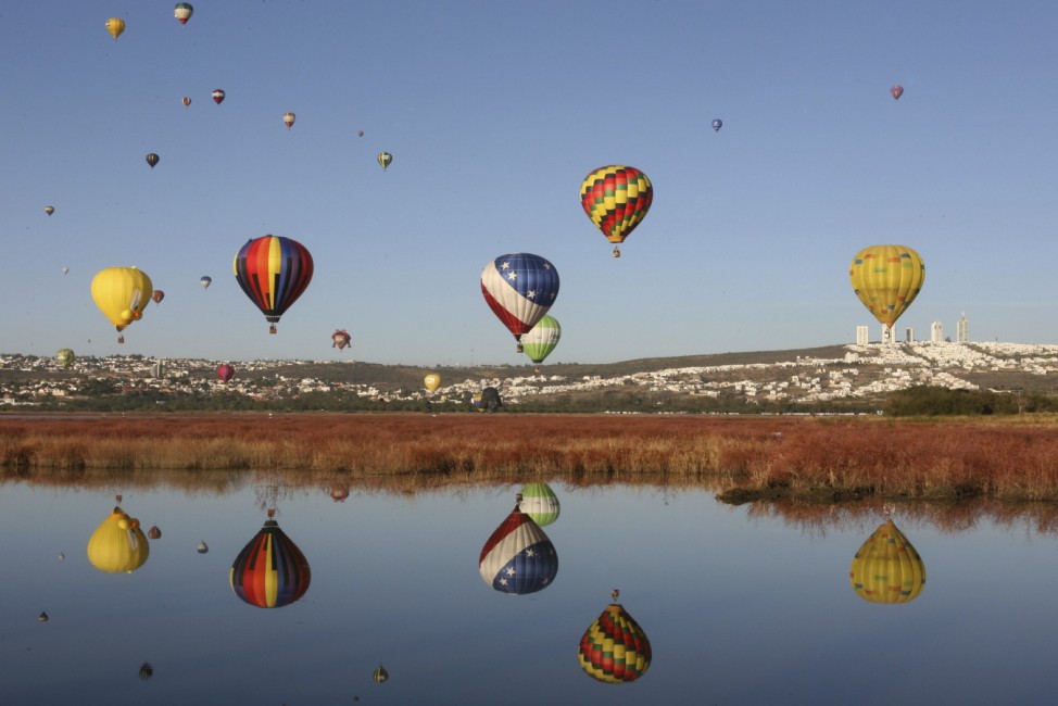 Hot air balloons fly over the Metropolitano park during the International Hot-Air Balloon Festival in Leon, in the Mexican state of Guanajuato
