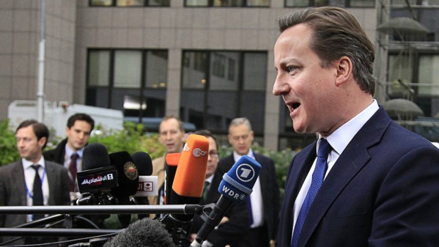 Britain's PM Cameron speaks to the media as he arrives at the EU council headquarters for an EU leaders summit discussing the EU's long-term budget in Brussels