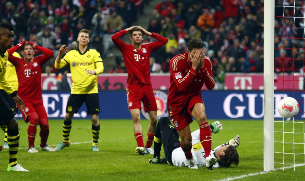 Gomez of Bayern Munich reacts after missing a chance to score during their German first division Bundesliga soccer match against Borussia Dortmund in Munich
