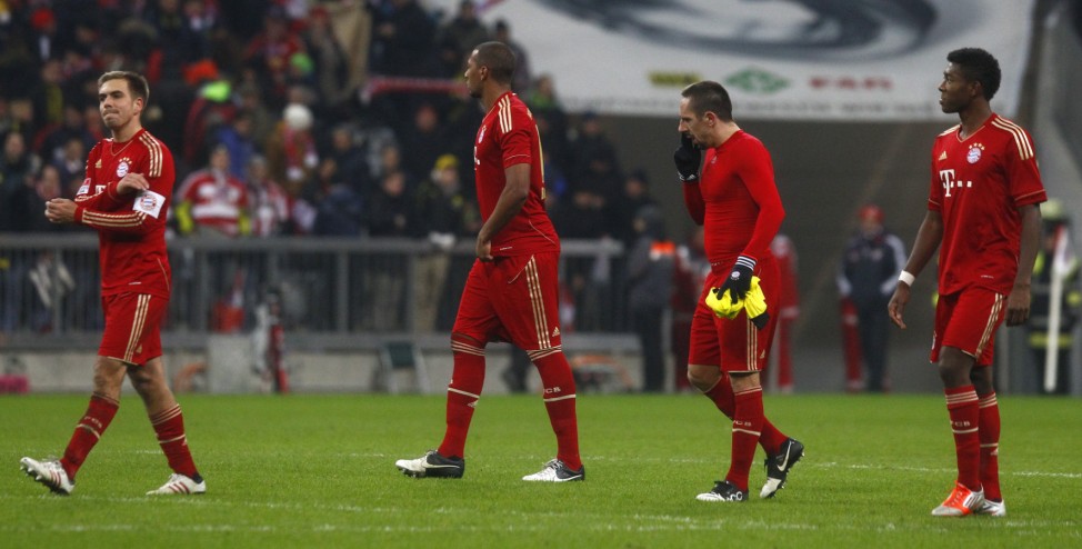 Bayern Munich's Lahm Boateng Ribery and Alaba leave pitch after German first division Bundesliga soccer match against Borussia Dortmund in Munich