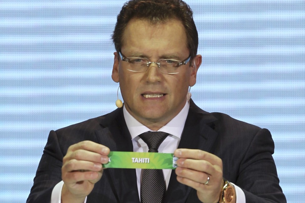 FIFA Secretary General Jerome Valcke holds up the name Tahiti during the official draw for FIFA Confederations Cup Brazil 2013 in Sao Paulo