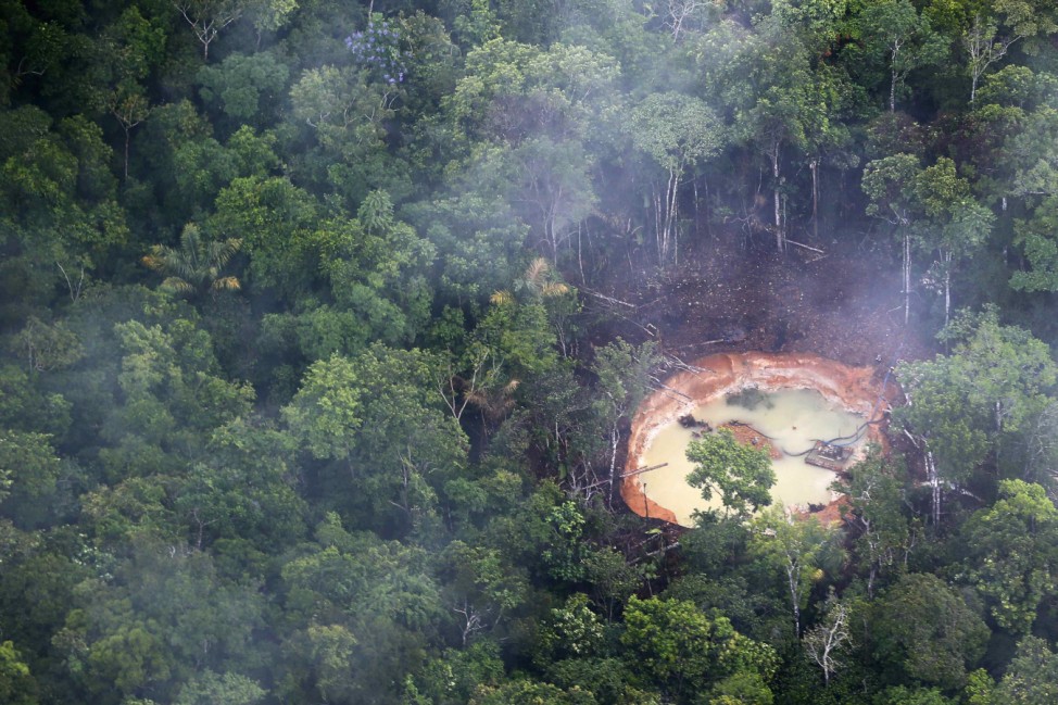 An aerial view shows an illegal mine in the jungle in the south of Venezuela