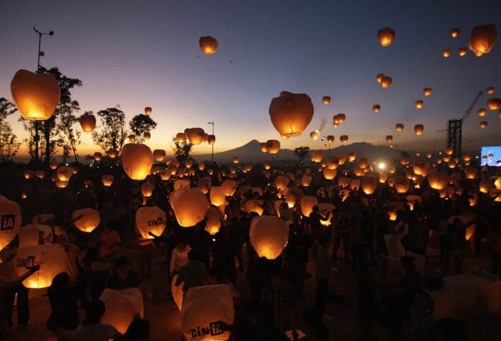 Participants launch sky lanterns during an event in Puebla, near Mexico City
