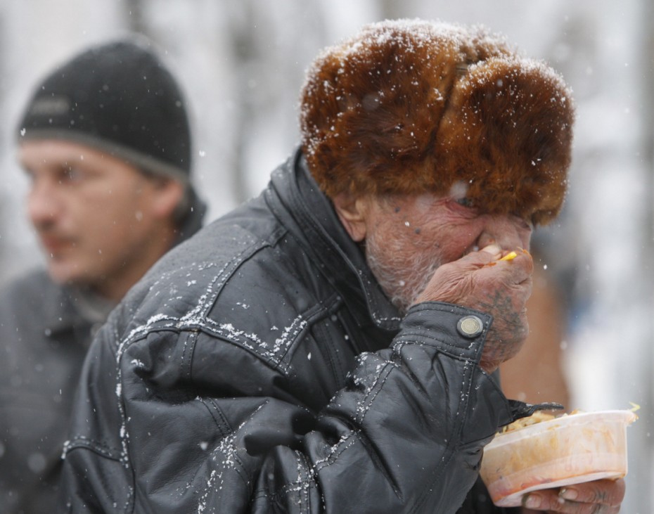 A man has a charity meal distributed by volunteers in Russia's southern city of Stavropol