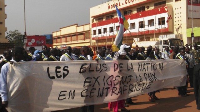 Residents of Central African Republic participate in a marching protest along the streets of the capital Bangui