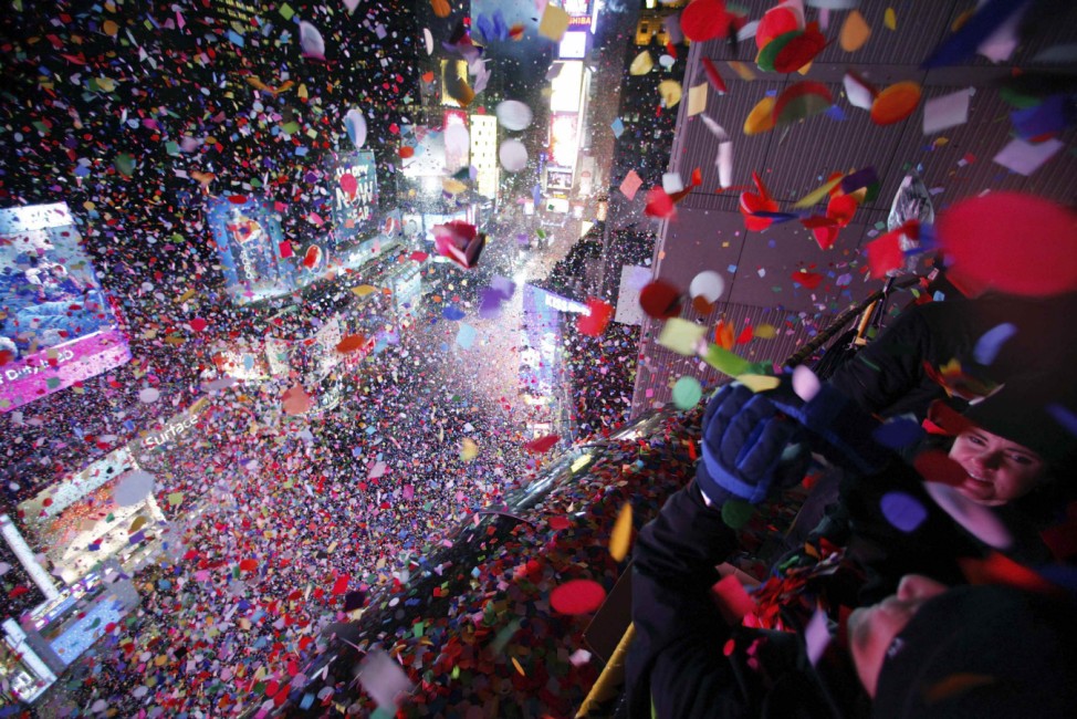 Confetti is dropped on revelers at midnight during New Year celebrations in Times Square in New York