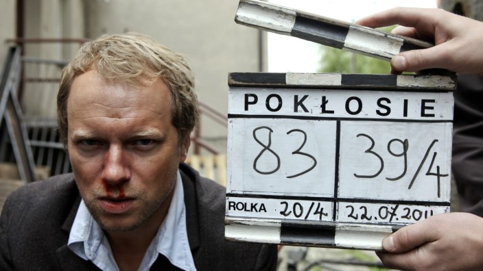 Polish actor Maciej Stuhr looks into a camera on set of the movie 'Poklosie' near Warsaw