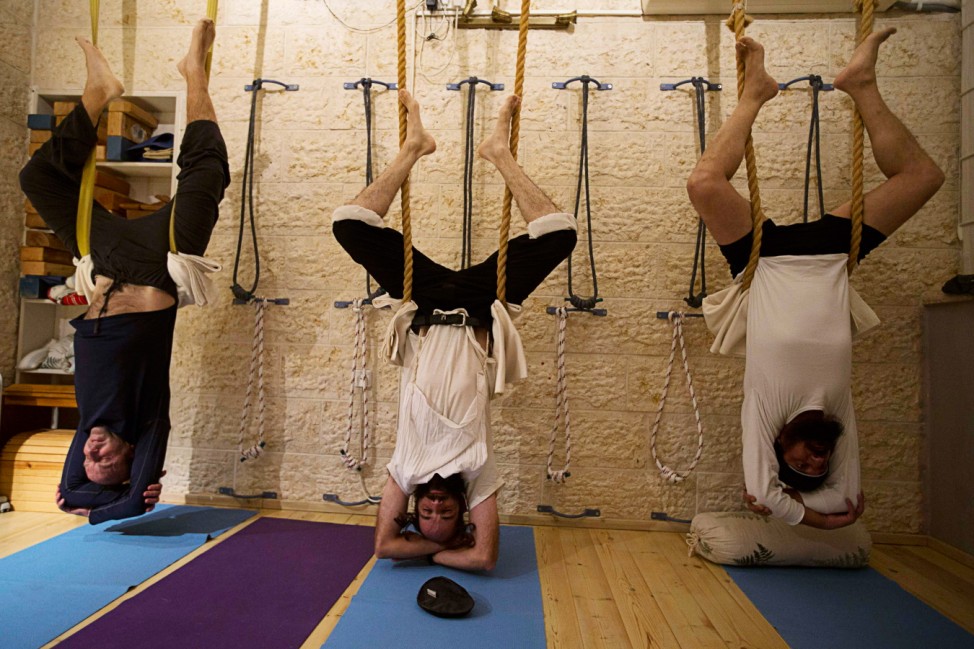 Ultra-Orthodox Jewish men take part in a yoga class at a studio near Jerusalem
