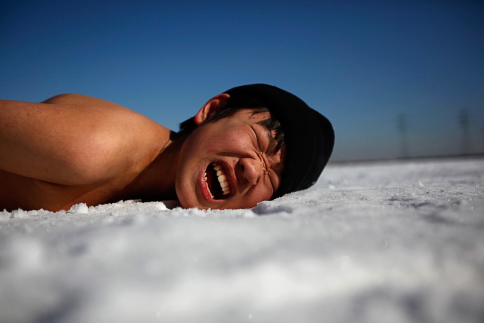 A student attending a winter military camp reacts during a training session in Ansan