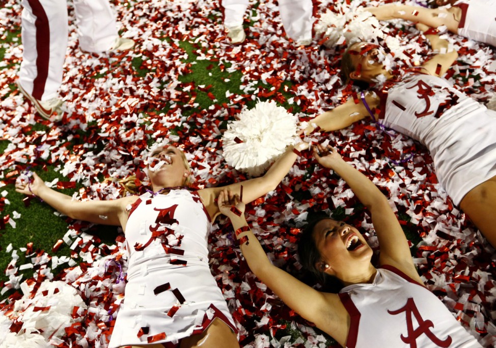 Alabama cheerleaders celebrate after their team defeated Notre Dame in their NCAA BCS National Championship college football game in Miami