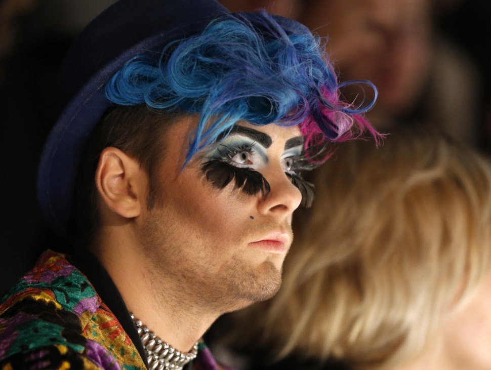 A visitor watches the presentation of creations by Anja Gockel at the Berlin Fashion Week Autumn/Winter 2013 in Berlin