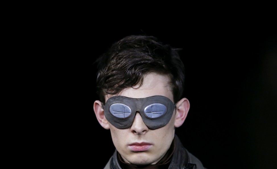 A model wears a mask as he presents a creation by G-Star Raw at the Berlin Fashion Week Autumn/Winter 2013 in Berlin