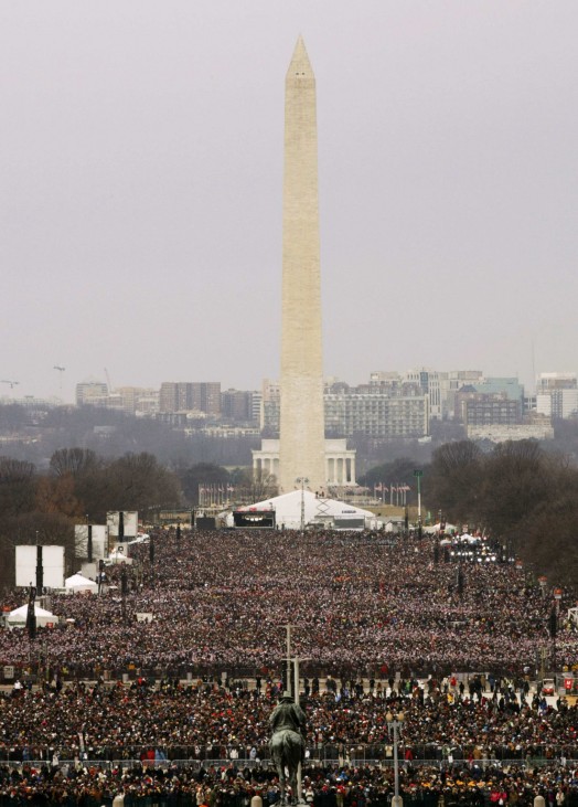 The Washington Monument is pictured, with crowds on the Mall before the start of swearing-in ceremonies for U.S. President Barack Obama on the West front of the U.S Capitol in Washington