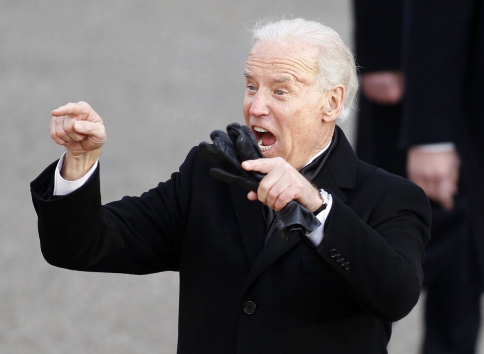 U.S. Vice President Joe Biden waves to the crowd during the inaugural parade in Washington