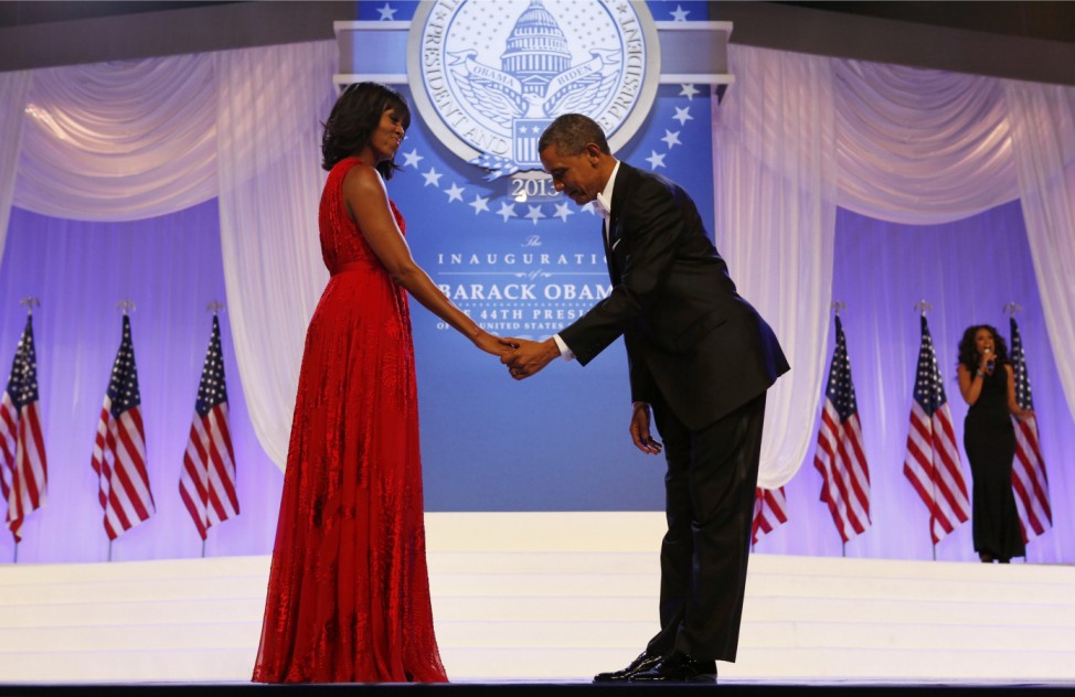 U.S. President Barack Obama bows to First Lady Michelle Obama at the Inaugural ball in Washington