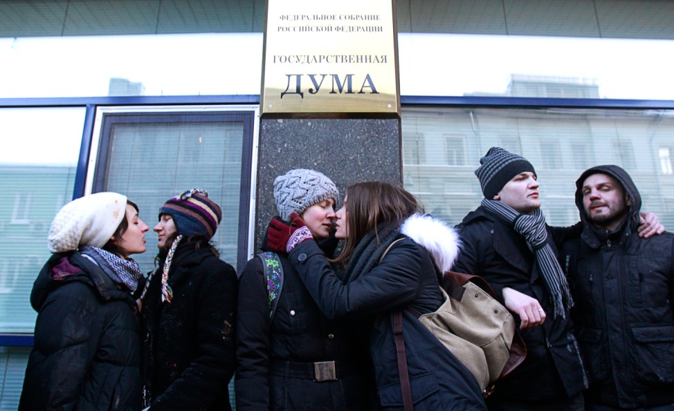 Gay rights activists kiss during a protest outside the Duma in Moscow