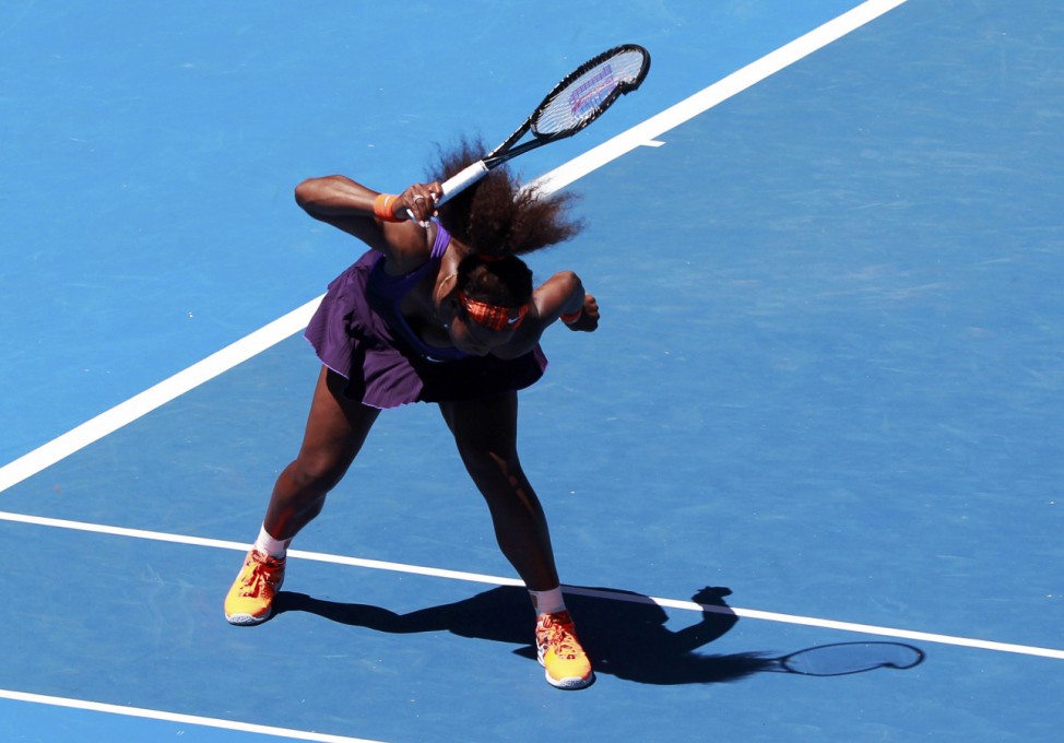 Serena Williams of the U.S. hits her racket into the ground during her women's singles quarter-final match against compatriot Sloane Stephens at the Australian Open tennis tournament in Melbourne