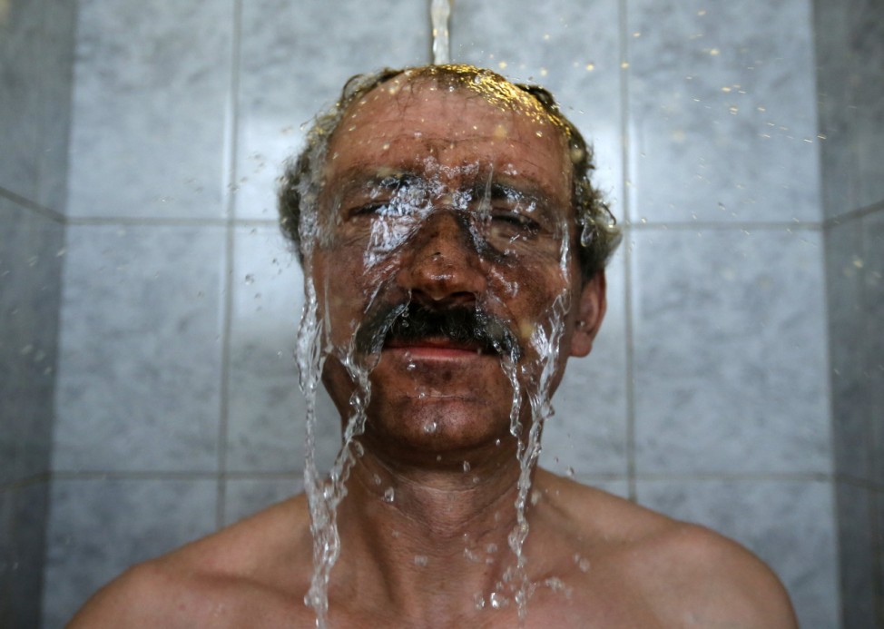 A miner takes a shower after his shift in Hungary's last remaining deep-cast coal mine at Markushegy