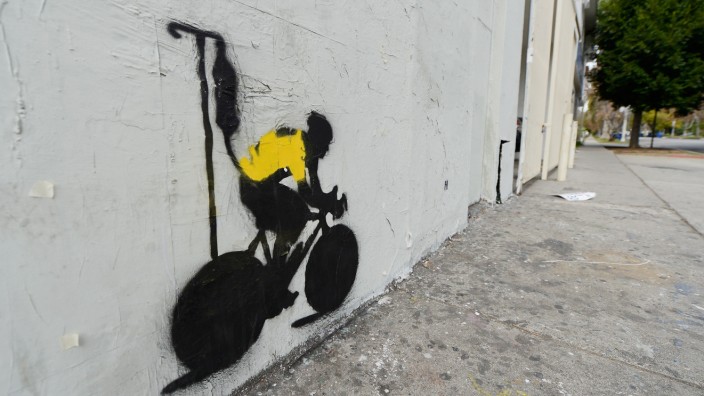 Stencil Graffiti Depicts Lance Armstrong In Yellow Jersey With IV Drip