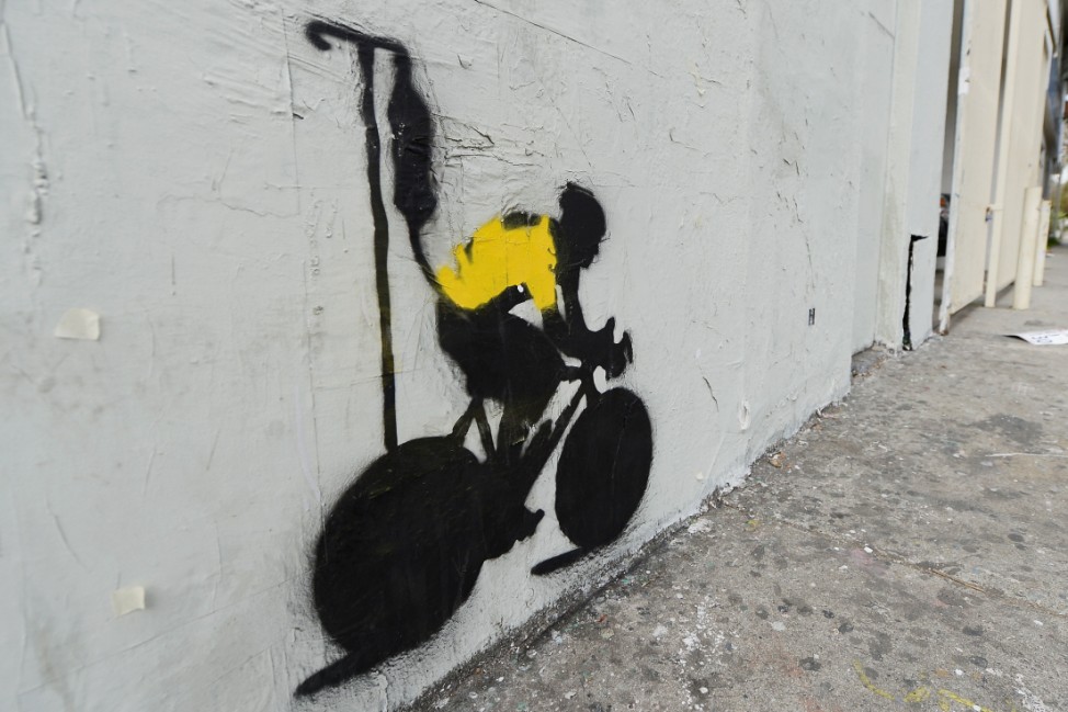 Stencil Graffiti Depicts Lance Armstrong In Yellow Jersey With IV Drip