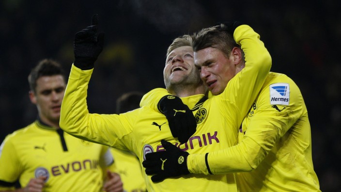 Borussia Dortmund's Jakub Blaszczykowski and Lukasz Piszczek celebrate a goal against Nuremberg during the German Bundesliga first division soccer match in Dortmund