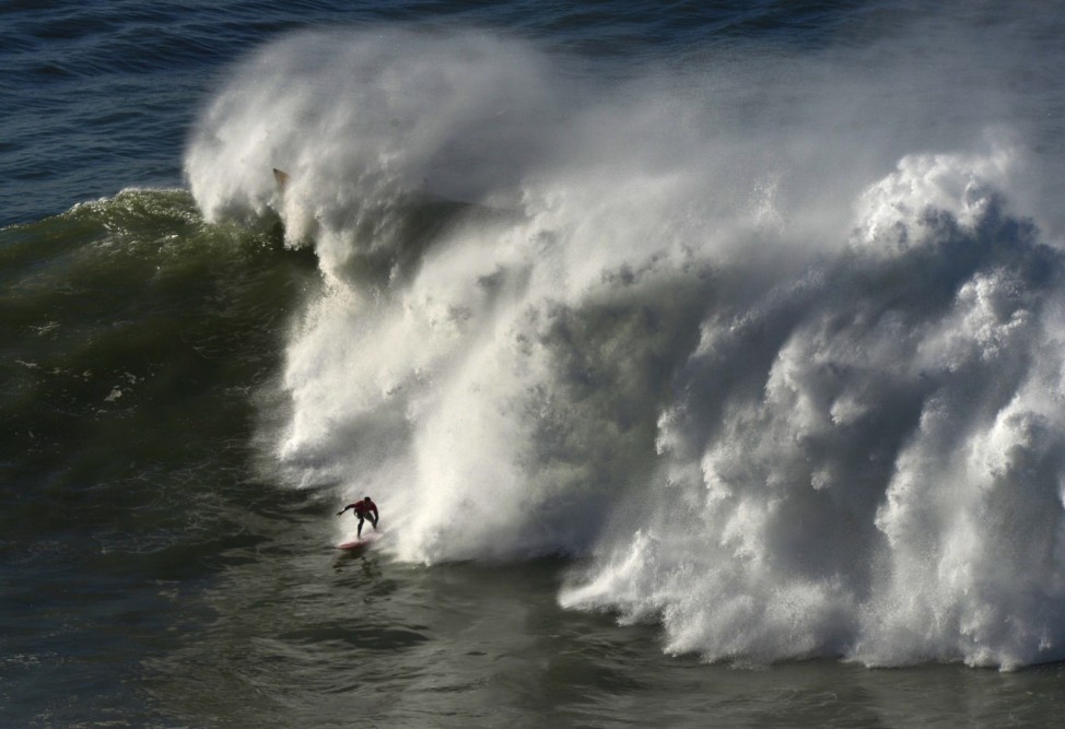 A surfer rides a wave during the Arnette Punta Galea Big Wave World Tour in Getxo