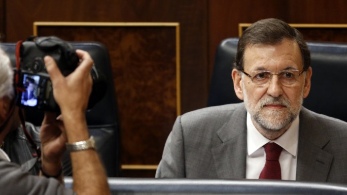 Spanish Prime Minister Mariano Rajoy is photographed in his seat at the start of a government's control session at Parliament in Madrid
