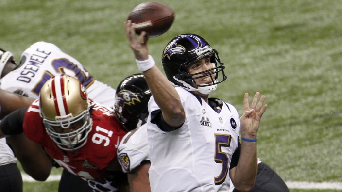 Baltimore Ravens quarterback Flacco throws a pass under pressure from San Francisco 49ers McDonald in the NFL Super Bowl XLVII football game in New Orleans
