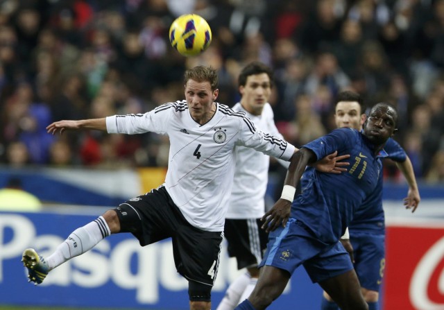 Germany's Hoewedes challenges France's Sissoko during their international friendly soccer match at the Stade de France stadium in Saint-Denis