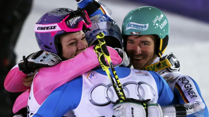Maria Hoefl-Riesch, Fritz Dopfer, and Felix Neureuther of Germany celebrate their third place finish after the national team event at the World Alpine Skiing Championships in Schladming