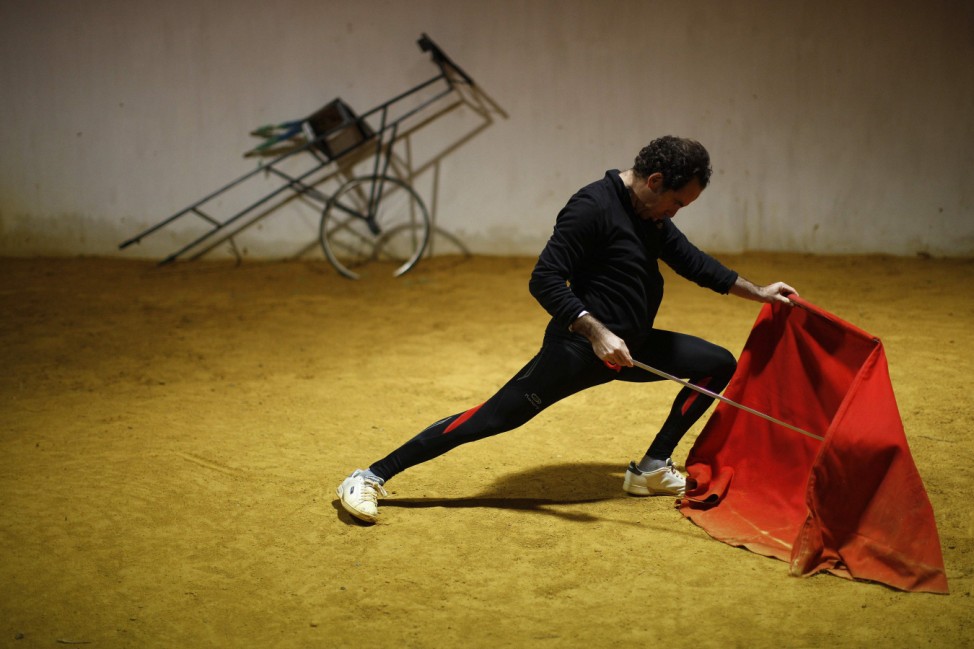Spanish bullfighter Rafael Tejada performs a pass during a training session at a training arena in Ronda