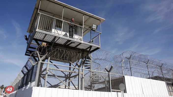 Israeli prison guard keeps watch from a tower at Ayalon prison in Ramle near Tel Aviv