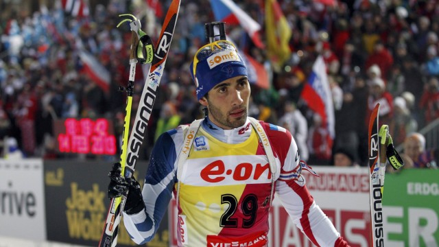 Fourcade of France reacts after crossing the finish line at the men's 20 km individual race during the International Biathlon Union World Championships in Nove Mesto