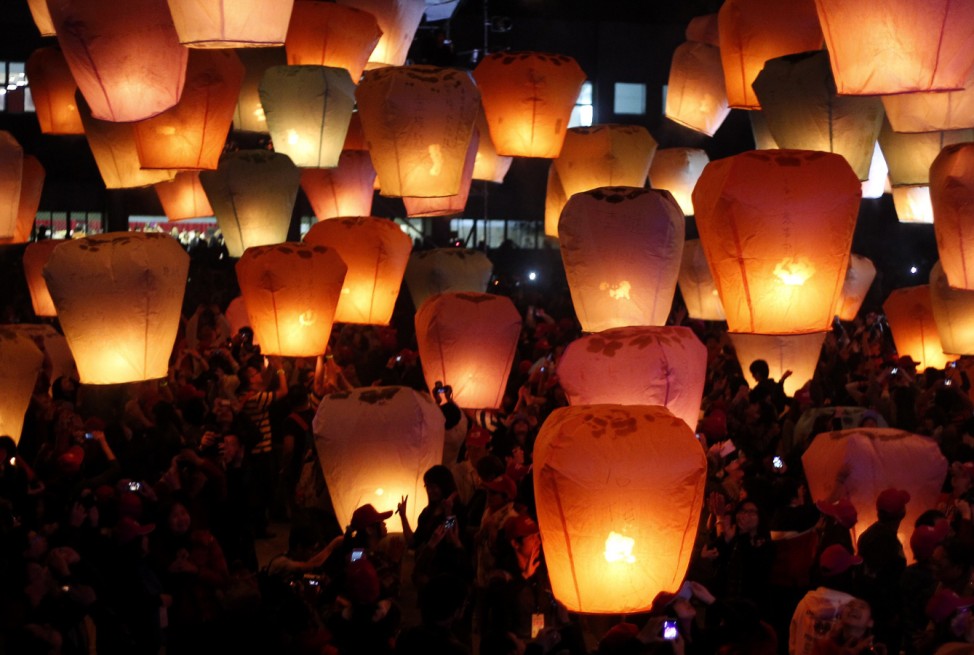 People release sky lanterns ahead of the traditional Chinese Lantern Festival in Pingxi