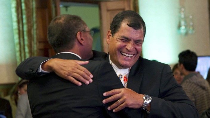 Ecuador's President Correa celebrates with his Vice President-elect Glass after hearing results at Carondelet Palace in Quito