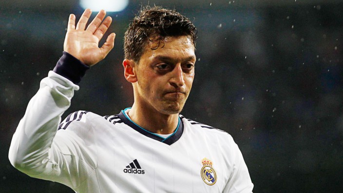 Real Madrid's Ozil gesture during Spanish first division soccer match against Rayo Vallecano at Santiago Bernabeu stadium in Madrid