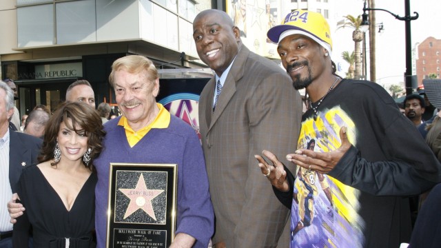 File photograph of Jerry Buss and rap artist Snapp Dogg posing on the Hollywood Walk of Fame in Hollywood
