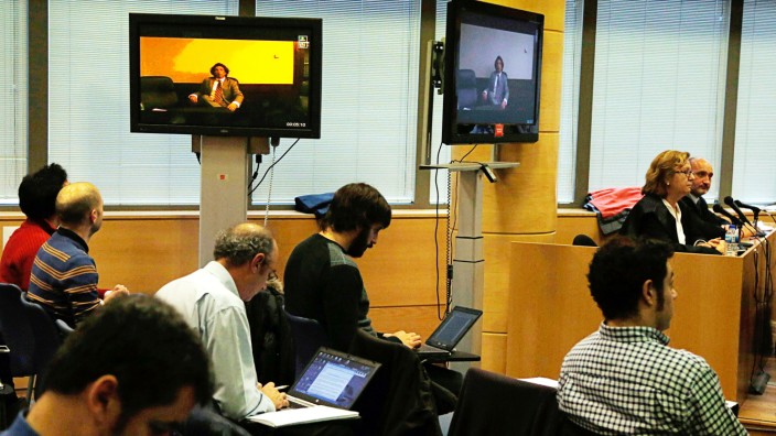 Former cyclist Tyler Hamilton of the U.S. testifies through video conference from the Spanish Embassy in Washington, during Operacion Puerto doping trial in Madrid