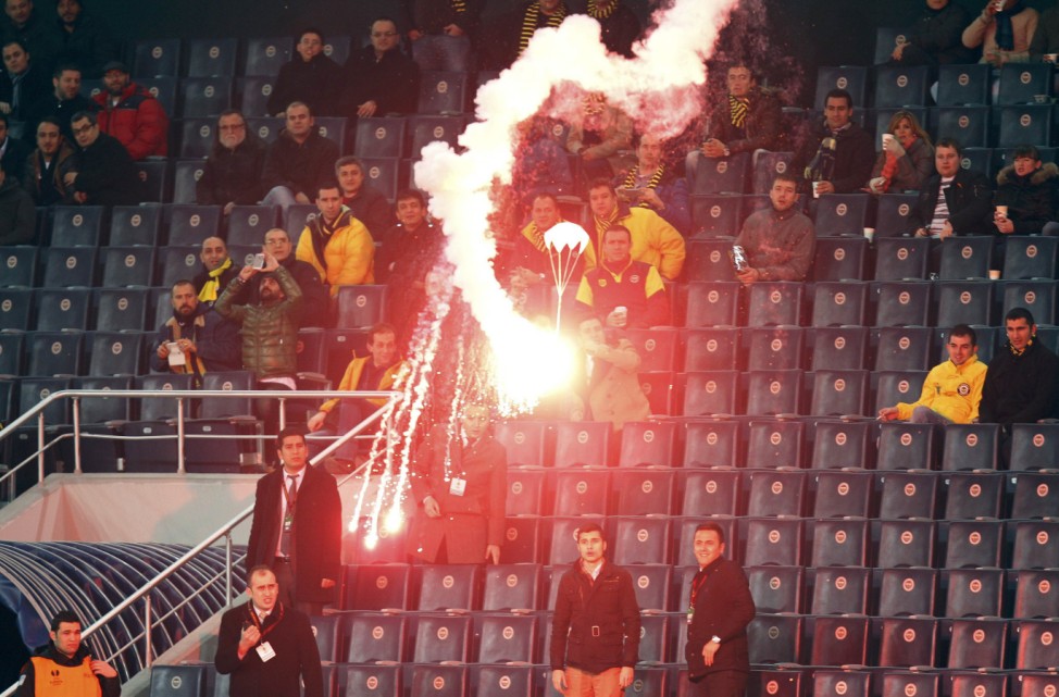 A flare on a parachute falls during the Europa League soccer match between BATE Borisov and Fenerbahce at Sukru Saracoglu stadium in Istanbul